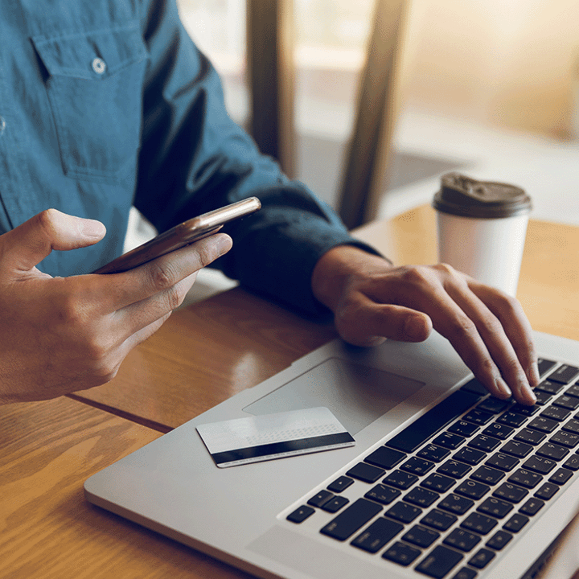 Person paying online using laptop