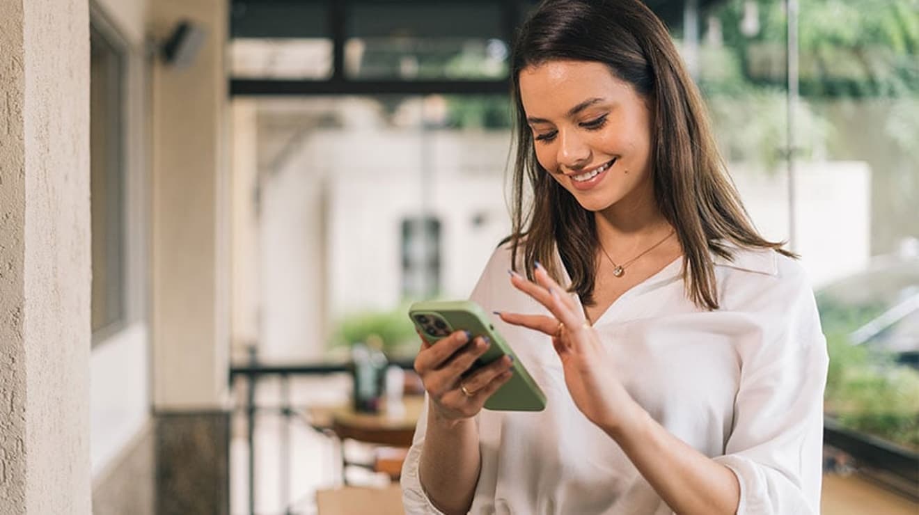 Woman paying bill on her phone