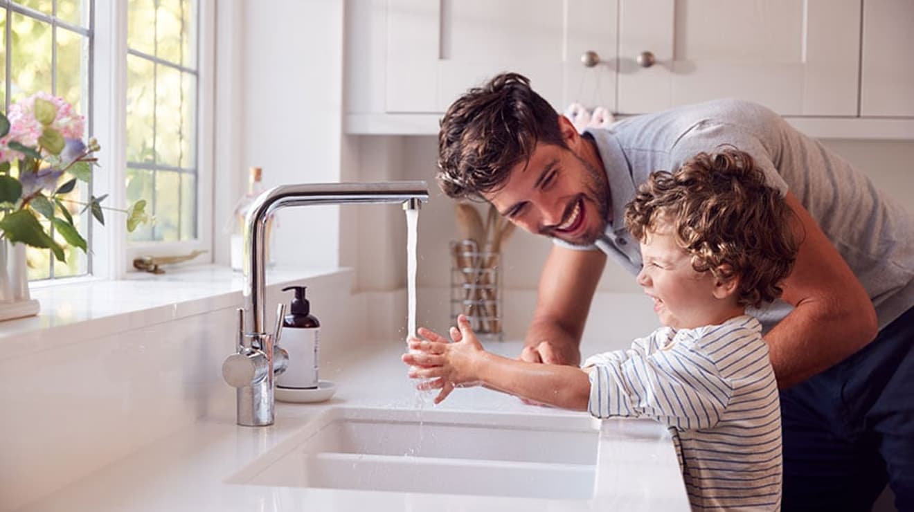 Father and son washing hands