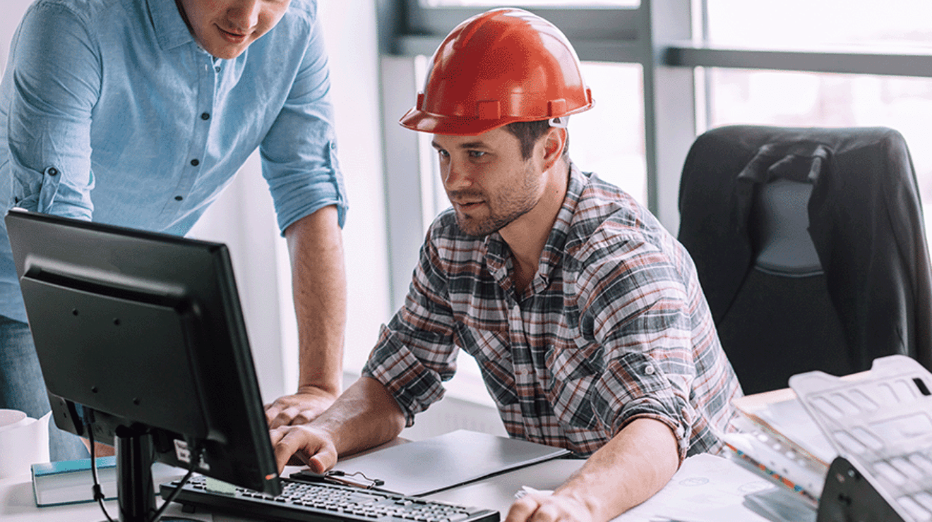 Builder working on the computer