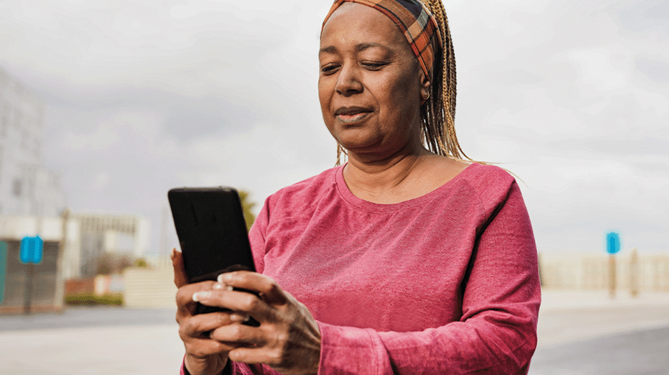 woman using mobile phone to contact us