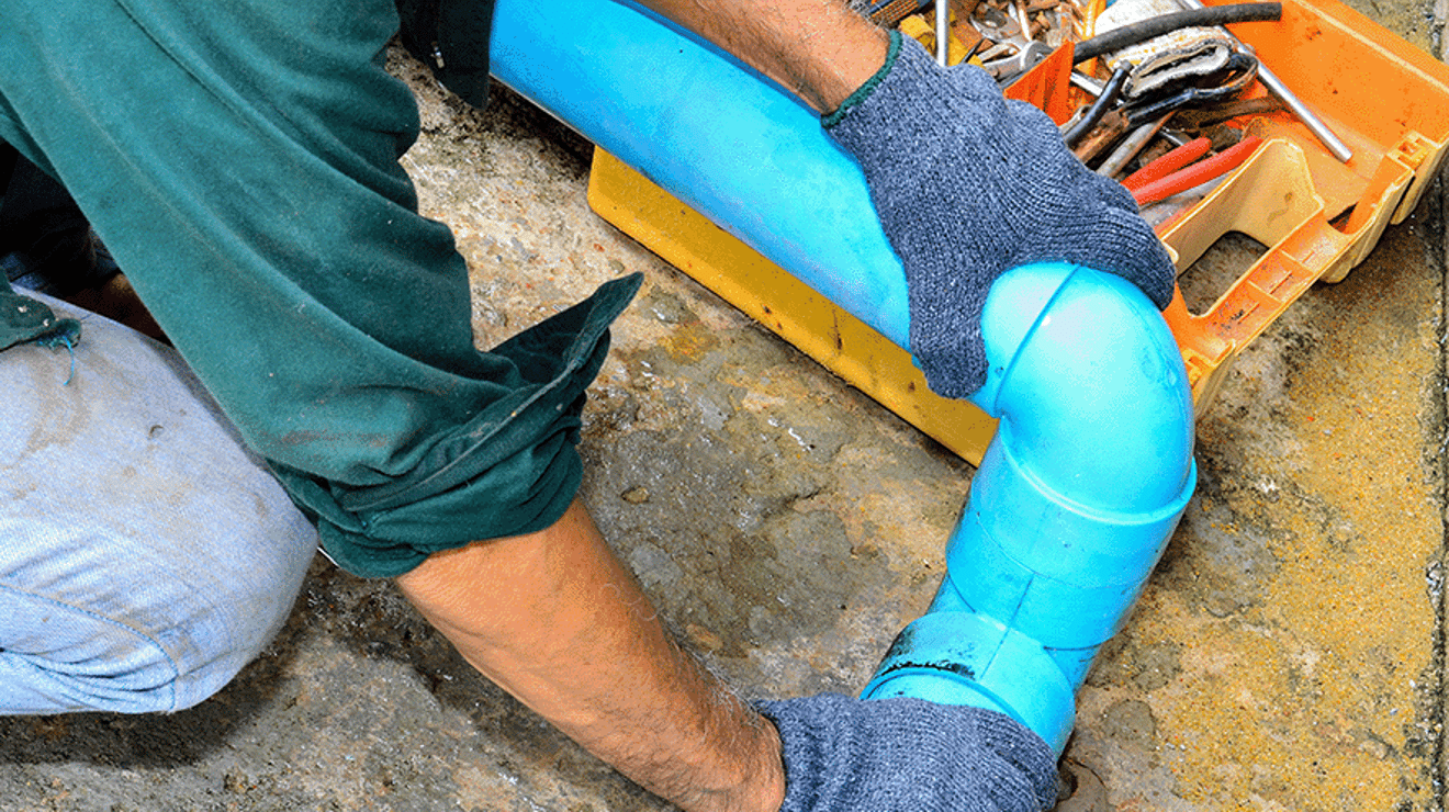 Builder laying a water pipe