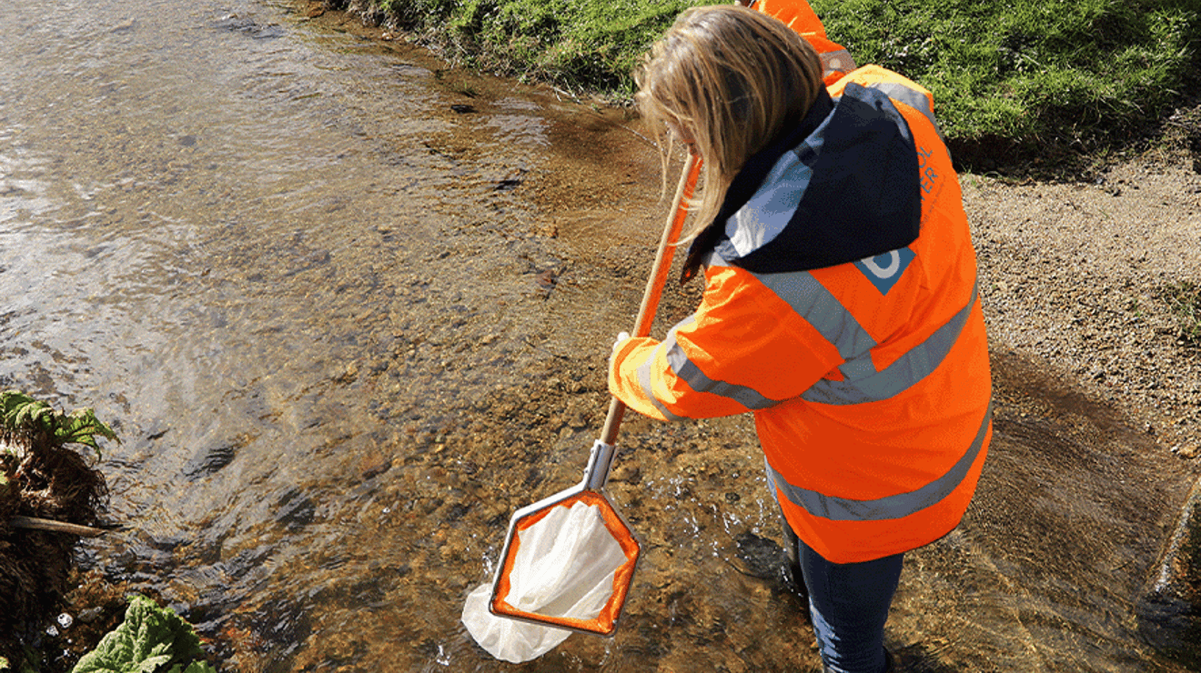 Upstream thinking worker in the river in bournemouth