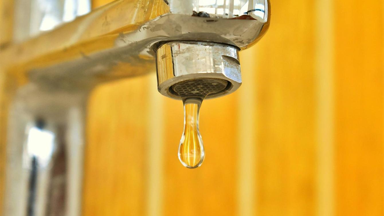 Close up of a tap with a water drip