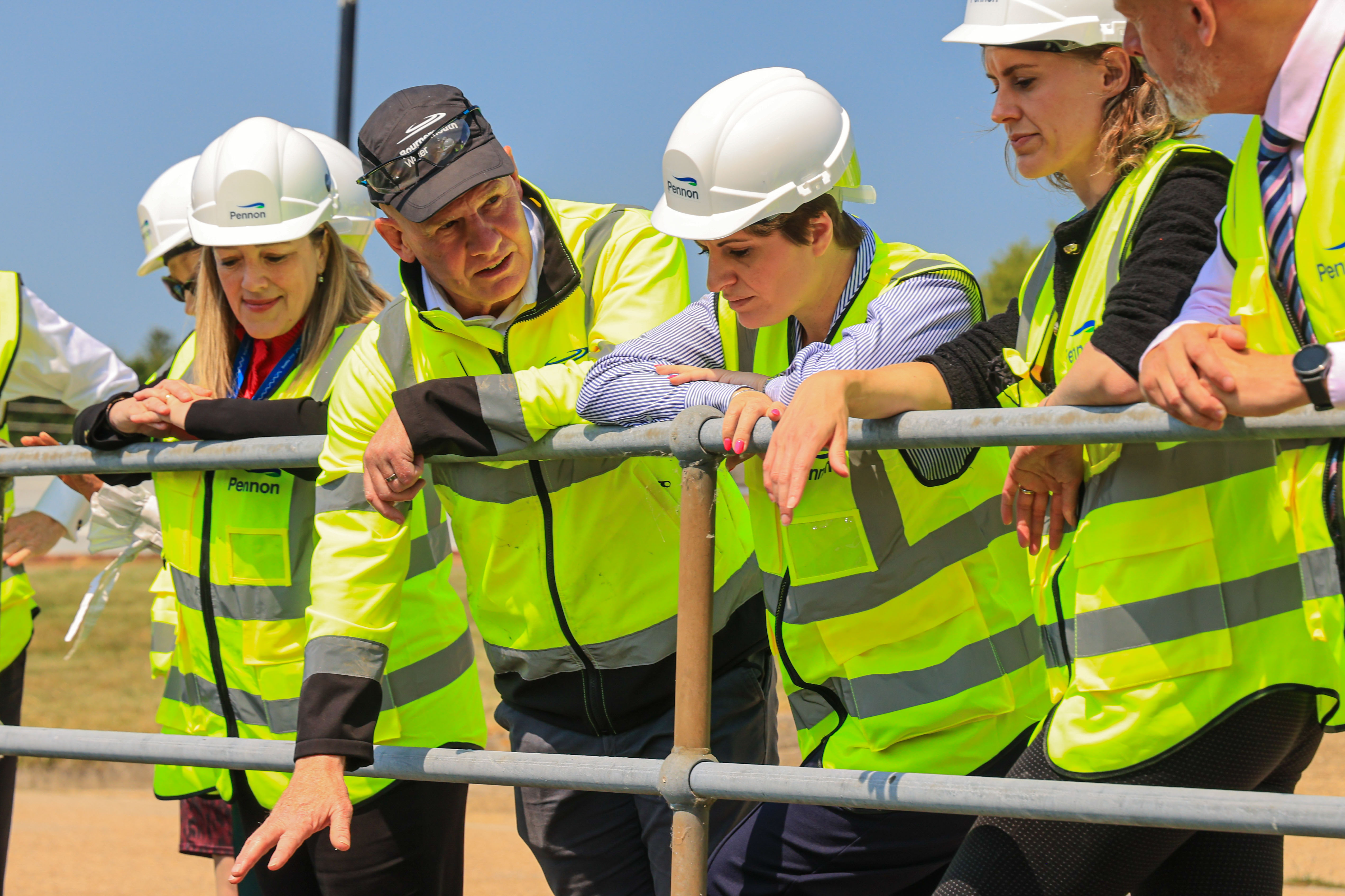 workers in high vis standing in Alderney Water Treatment Works