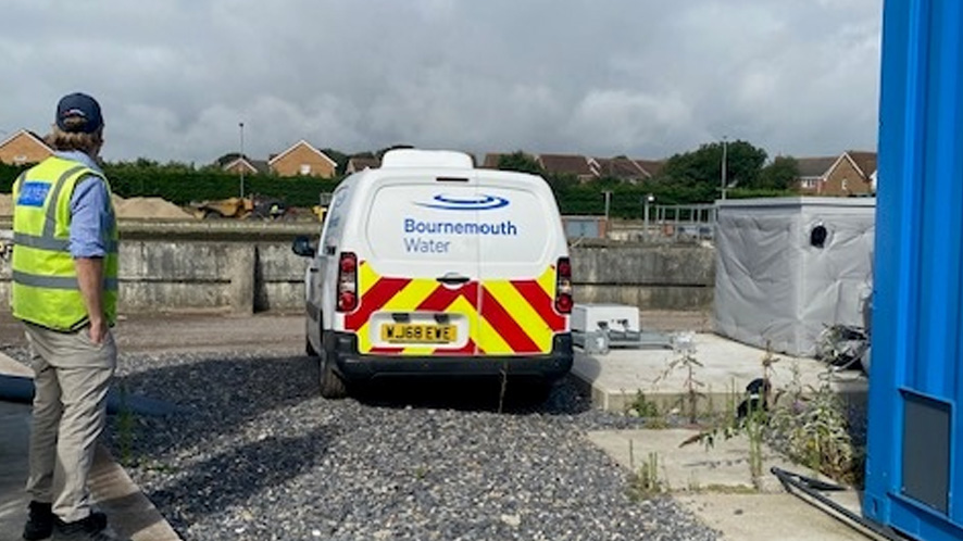 Bournemouth water worker next to van