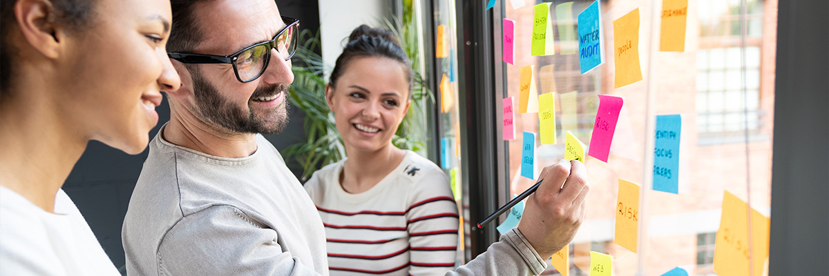 team meeting, post-it ideas stuck on window